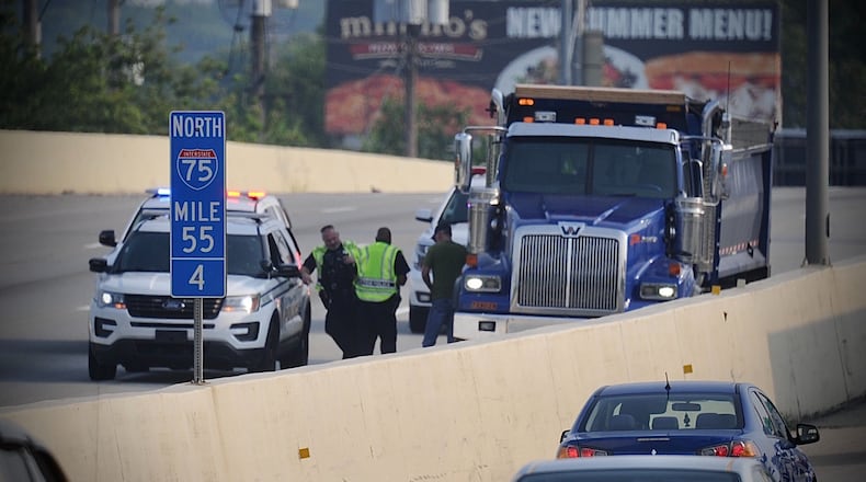At least one person was killed in a two-vehicle crash involving a motorcycle on I-75 south near Stanley Avenue on Friday, July 30, 2021. MARSHALL GORBY / STAFF