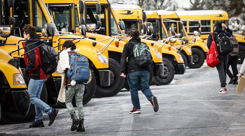 Stebbins High School students load onto the buses Wednesday afternoon January 17, 2024. Mad River schools were on a two-hour delay because of the cold weather. JIM NOELKER/STAFF