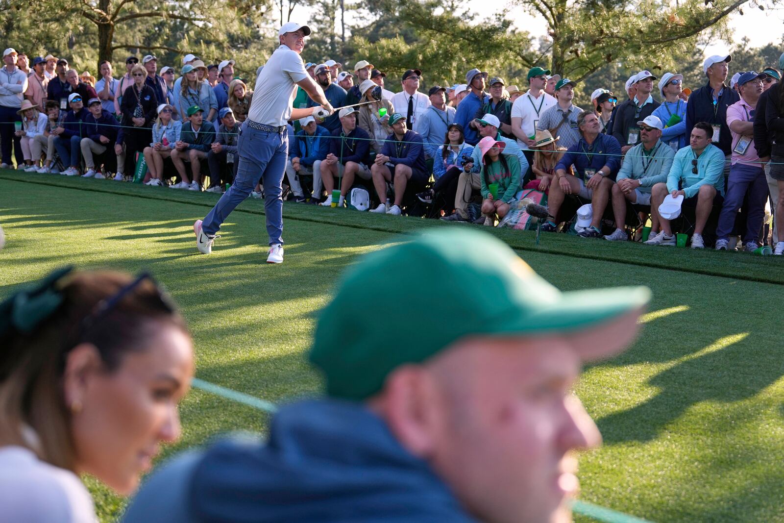 Rory McIlroy, of Northern Ireland, watches his tee shot on the 18th hole during the third round at the Masters golf tournament, Saturday, April 12, 2025, in Augusta, Ga. (AP Photo/Ashley Landis)