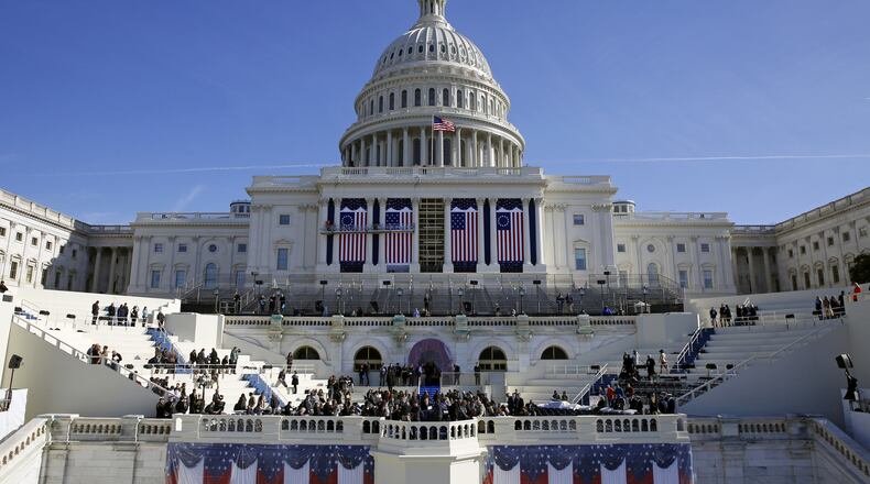 The U.S. Capitol looms over a stage during a rehearsal of President-elect Donald Trump's swearing-in ceremony, Sunday, Jan. 15, 2017, in Washington. (AP Photo/Patrick Semansky)