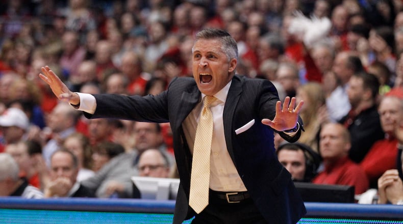 Georgia Tech coach Brian Gregory shouts to his players during a game against Dayton on Tuesday, Dec. 23, 2014, at UD Arena. David Jablonski/Staff