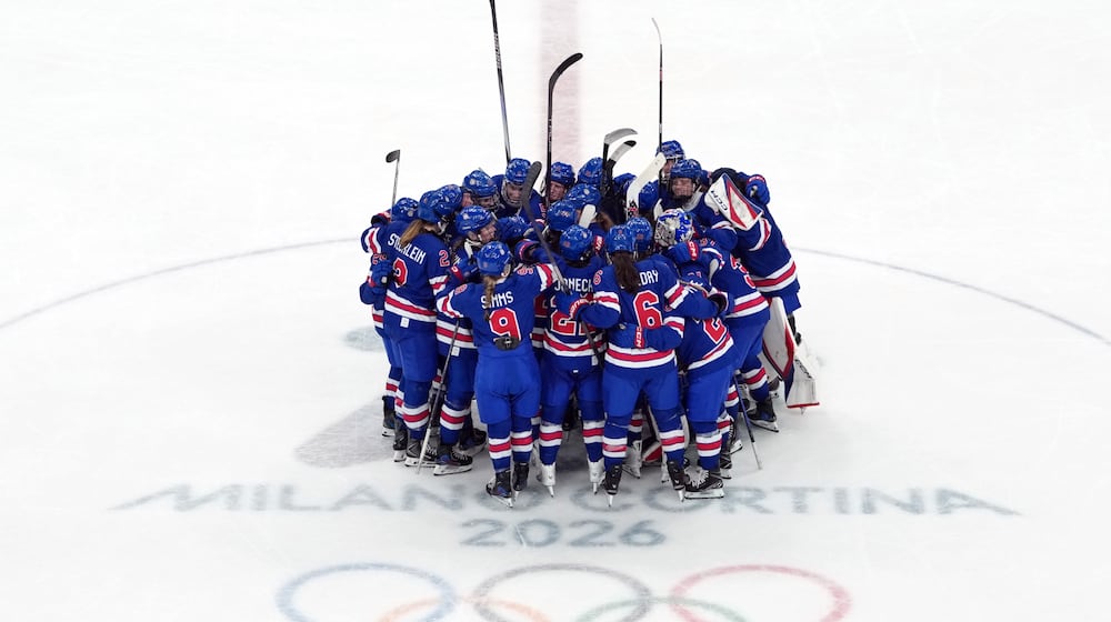 Team United States celebrates after their win over Sweden in a women's ice hockey semifinal match at the 2026 Winter Olympics, in Milan, Italy, Monday, Feb. 16, 2026. (AP Photo/Carolyn Kaster)
