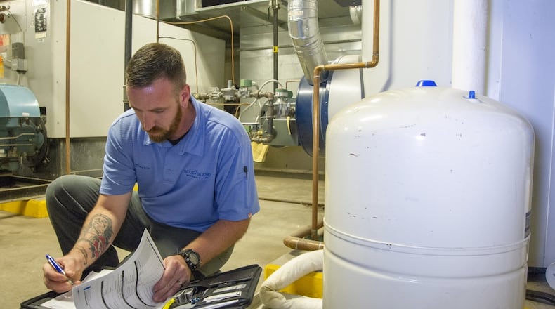 Dustin Wulfeck, a Solid Blend Water Management Solutions employee, at work. Contributed