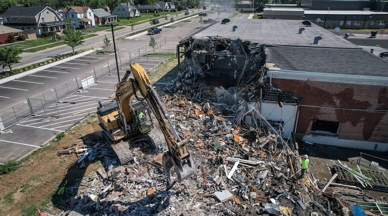 Crews demolish C.F. Holiday Elementary School at 4100 South Dixie Drive Tuesday June 21, 2022. JIM NOELKER/STAFF