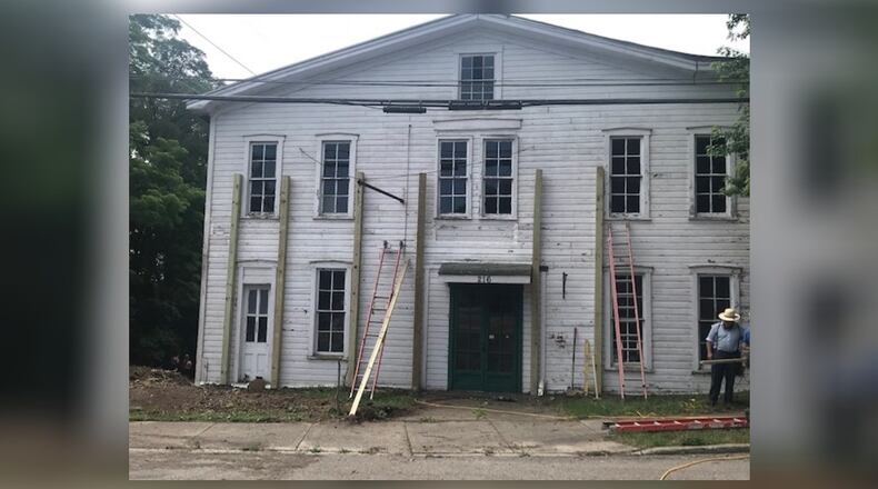Crews work to stabilize the Buggy Whip building in downtown Tipp City in June 2020. Contributed photo