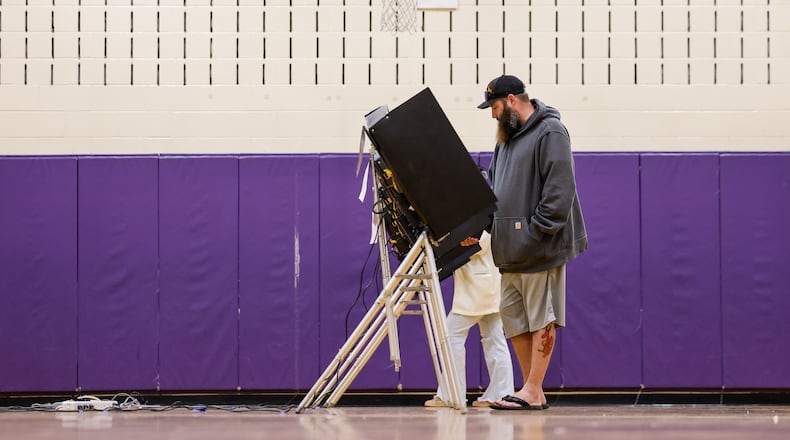 Derek Wright votes at the polling location in the gymnasium of Creekview Elementary School Tuesday, Nov. 4, 2025 in Middletown. NICK GRAHAM/STAFF