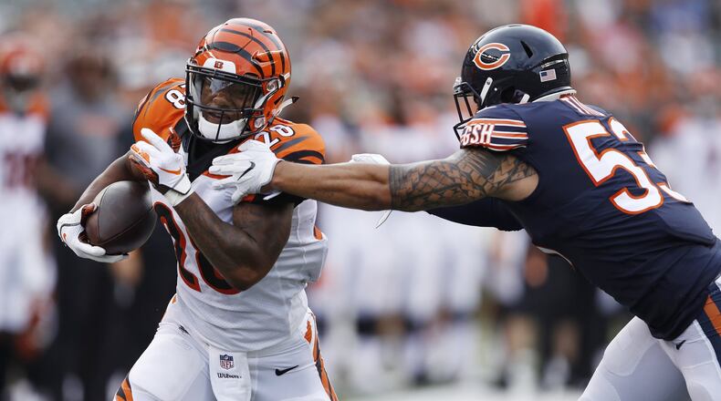 CINCINNATI, OH - AUGUST 09: Joe Mixon #28 of the Cincinnati Bengals makes a move against John Timu #53 of the Chicago Bears on his way to a 24-yard touchdown reception in the first quarter of a preseason game at Paul Brown Stadium on August 9, 2018 in Cincinnati, Ohio. (Photo by Joe Robbins/Getty Images)