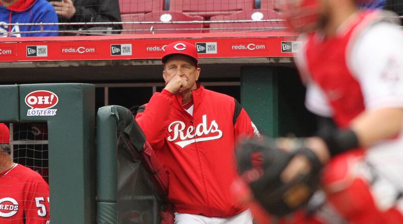 Reds manager Jim Riggleman watches a game against the Braves on April 23, 2018, at Great American Ball Park in Cincinnati.