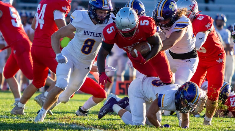 Troy's Jahari Ward dives for yardage against Butler's Austin Flohre (8) and Derek Hobbs (33) earlier this season at Troy Memorial Stadium. Jeff Gilbert/CONTRIBUTED