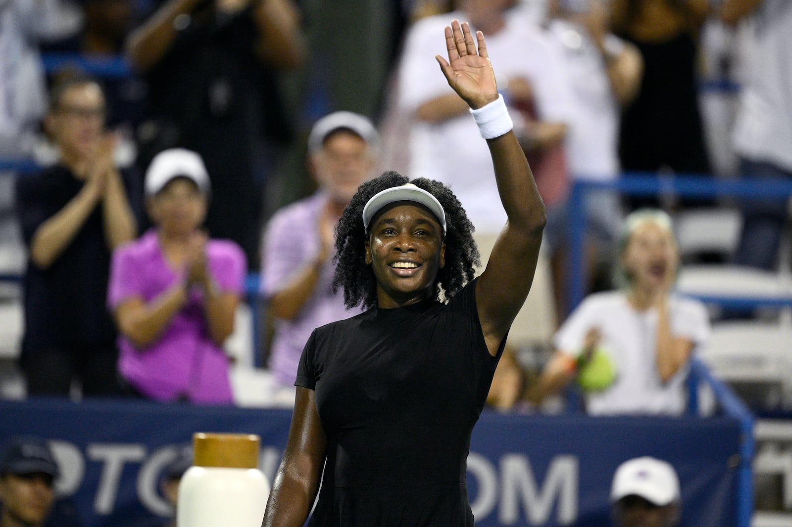 Venus Williams waves to the crowd after she lost to Magdalena Frech, of Poland, during a match at the Citi Open tennis tournament Thursday, July 24, 2025, in Washington. (AP Photo/Nick Wass)