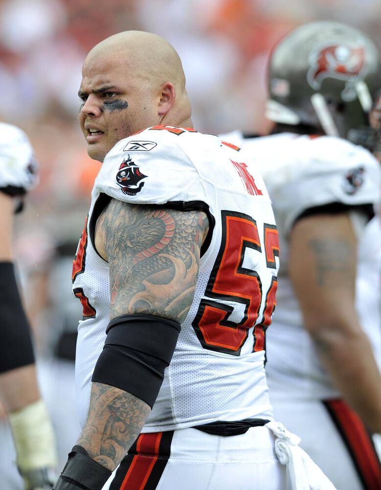 The coaching staff says Buccaneers center Jeff Faine (52) is adept at recognizing defenses and making calls at the line. He started 28 games at center in two seasons for the Buccaneers (2008-09).