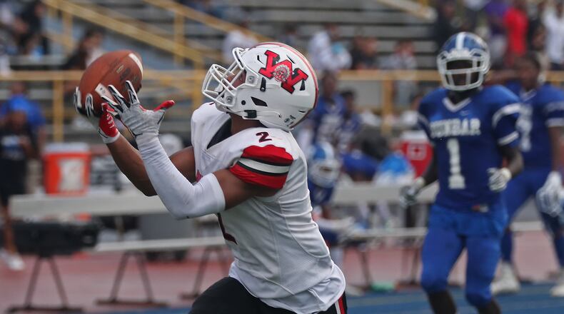 Wayne's Bryan Kinley catches a pass for a touchdown during Friday's game against Dunbar. BILL LACKEY/STAFF