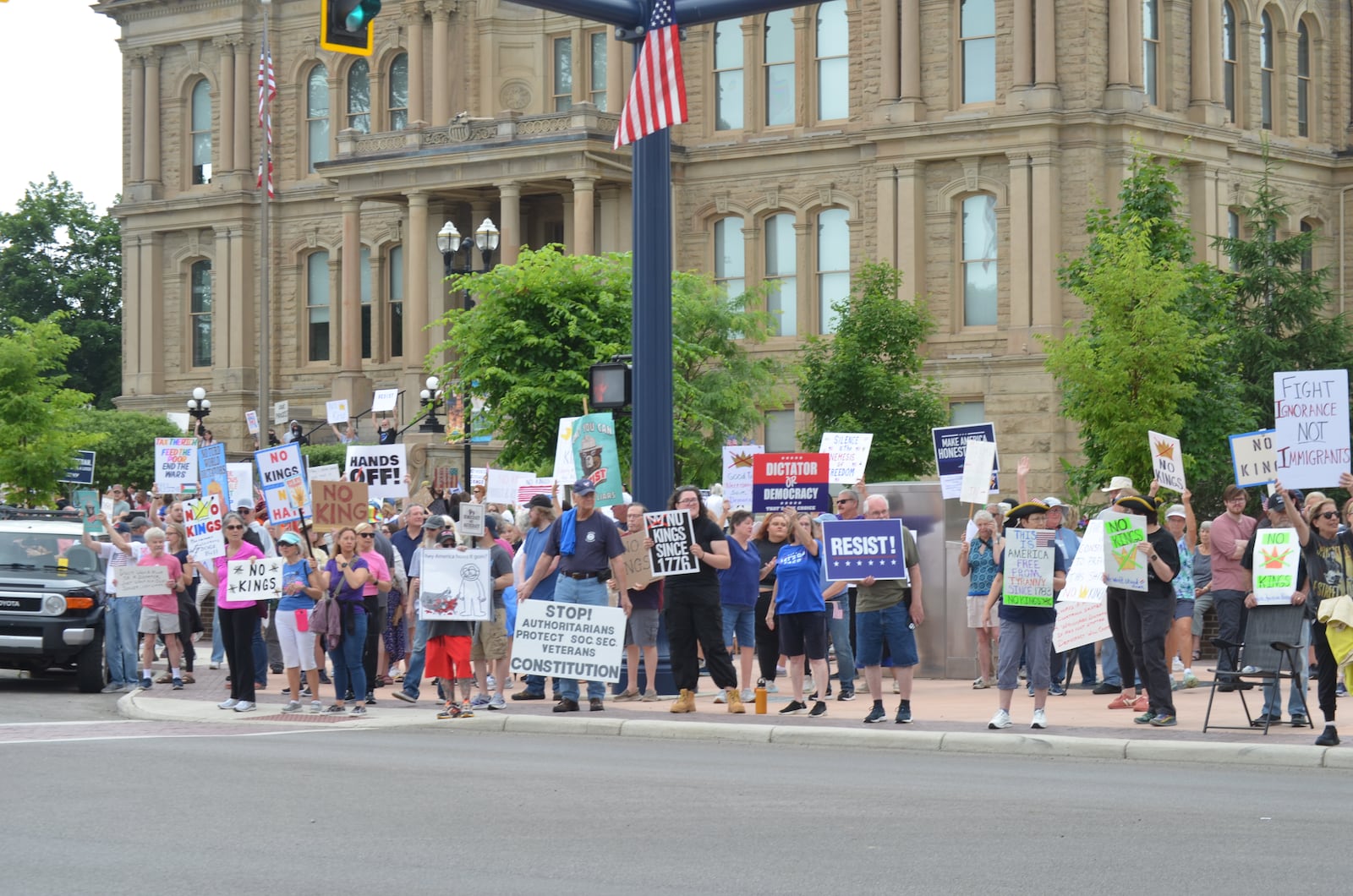 People attend a "No Kings" protest at the Miami County Courthouse on Saturday, June 14, 2025. It was one of hundreds across the United States. MATT CLEVENGER/CONTRIBUTED PHOTO