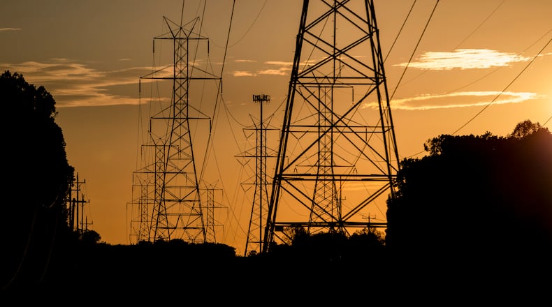 FILE â The sun sets behind power lines in Gaithersburg, Md., Oct. 23, 2020. (Samuel Corum/The New York Times)