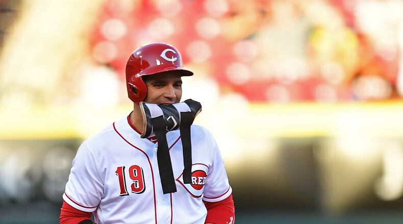 CINCINNATI, OH - AUGUST 9:  Joey Votto #19 of the Cincinnati Reds removes his pad and gloves after hitting a double in the first inning against the San Diego Padres at Great American Ball Park on August 9, 2017 in Cincinnati, Ohio.  (Photo by Jamie Sabau/Getty Images)