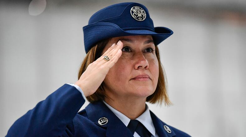 Chief Master Sgt. JoAnne S. Bass salutes during the national anthem at the beginning of a chief master sergeant of the Air Force change of responsibility ceremony at Joint Base Andrews, Md., Aug. 14. Bass succeeded Chief Master Sgt. of the Air Force Kaleth O. Wright as the 19th chief master sergeant of the Air Force. (U.S. Air Force photo/Eric Dietrich)