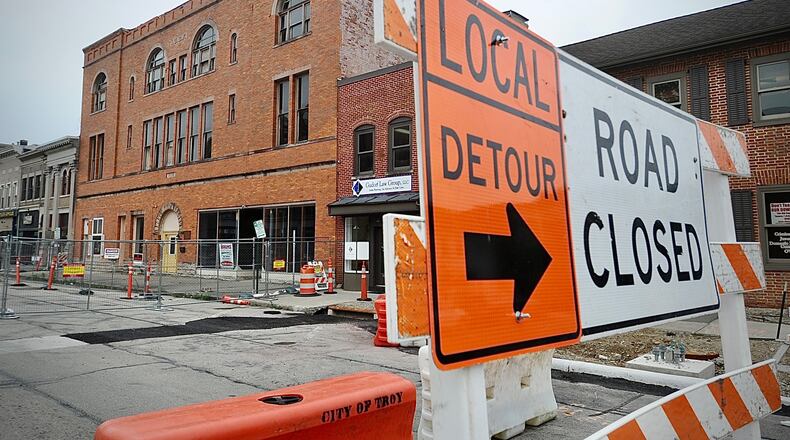 The 100 block of West Main Street in Troy is completely blocked off June 27, 2023, after city officials declared the controversial Tavern building there unsafe. MARSHALL GORBY \STAFF