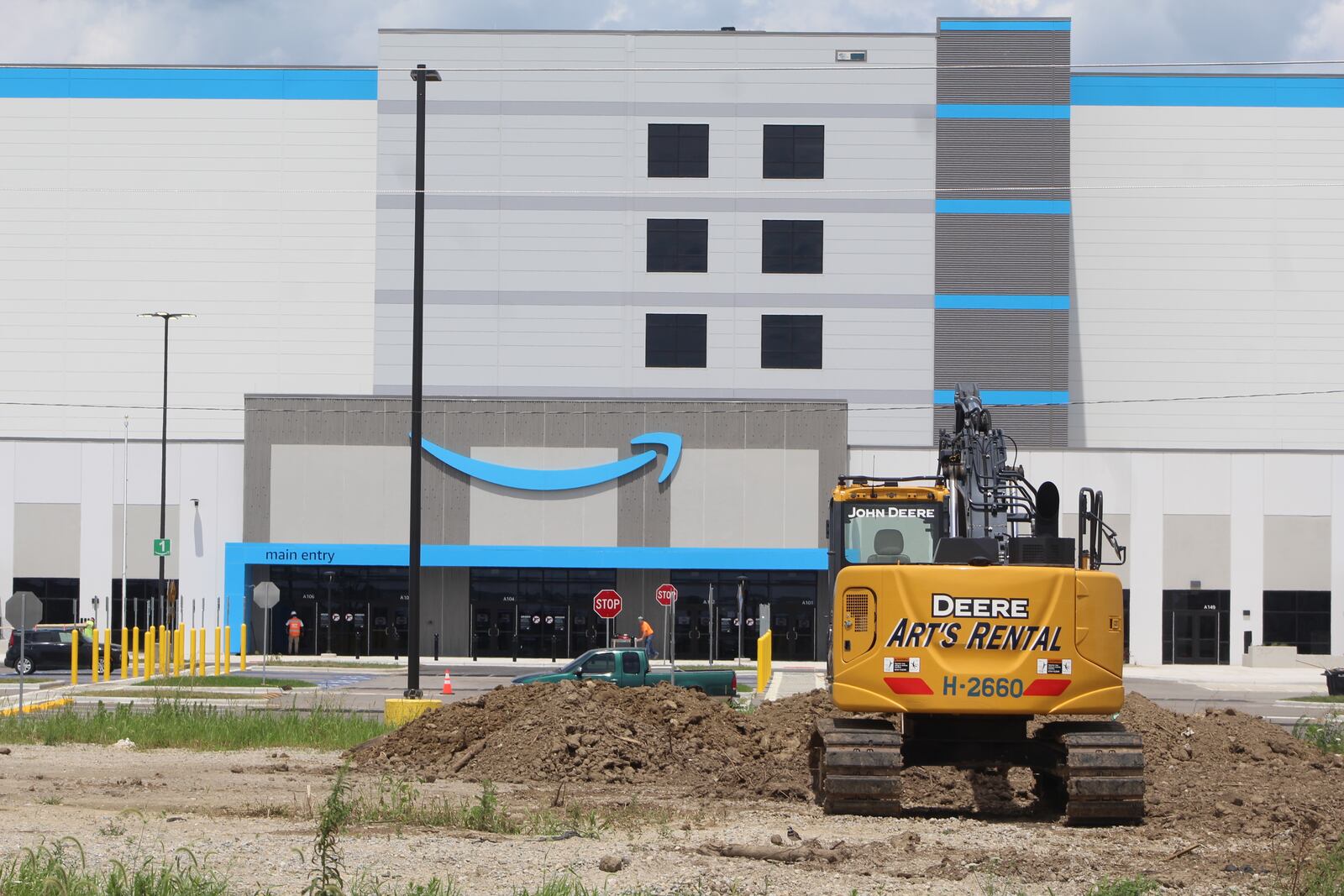 Amazon's massive new fulfillment facility is under construction at 1835 Union Airpark Blvd. A piece of construction equipment sits outside of the parking lot in front of the main entrance. CORNELIUS FROLIK / STAFF