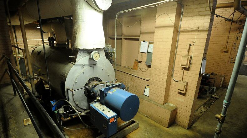 The Troy school district will construct four new buildings to replace seven old ones like the over 100-year-old Van Cleve Building. Chris Piper, Troy superintendent, said earlier in 2023 that the cost to maintain the buildings was taking all of the district’s permanent improvement levy money. MARSHALL GORBY\STAFF