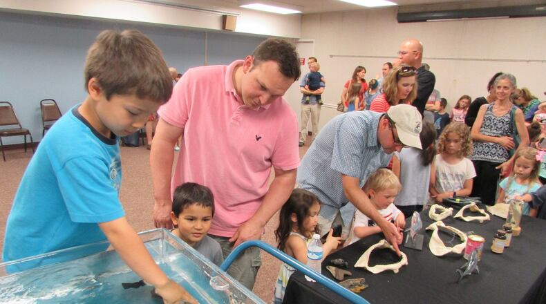 Families learned about sharks and enjoyed a chance to pet them at an educational program during Wright Memorial Library’s 2016 Summer Reading Club. The library plans to use a new grant to expand its educational programming and services. CONTRIBUTED