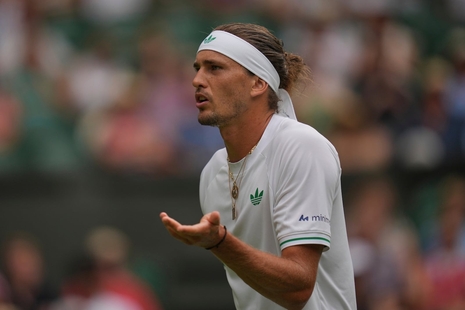 Alexander Zverev of Germany reacts as he plays Arthur Rinderknech of France during their first round men's singles match at the Wimbledon Tennis Championships in London, Tuesday, July 1, 2025. (AP Photo/Kin Cheung)