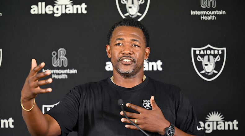 Las Vegas Raiders defensive coordinator Patrick Graham speaks with the media following practice at NFL football training camp, Thursday, July 25, 2024, in Costa Mesa, Calif. The Bengals reportedly interviewed Graham for their vacant defensive coordinator job on Wednesday. (AP Photo/John McCoy)