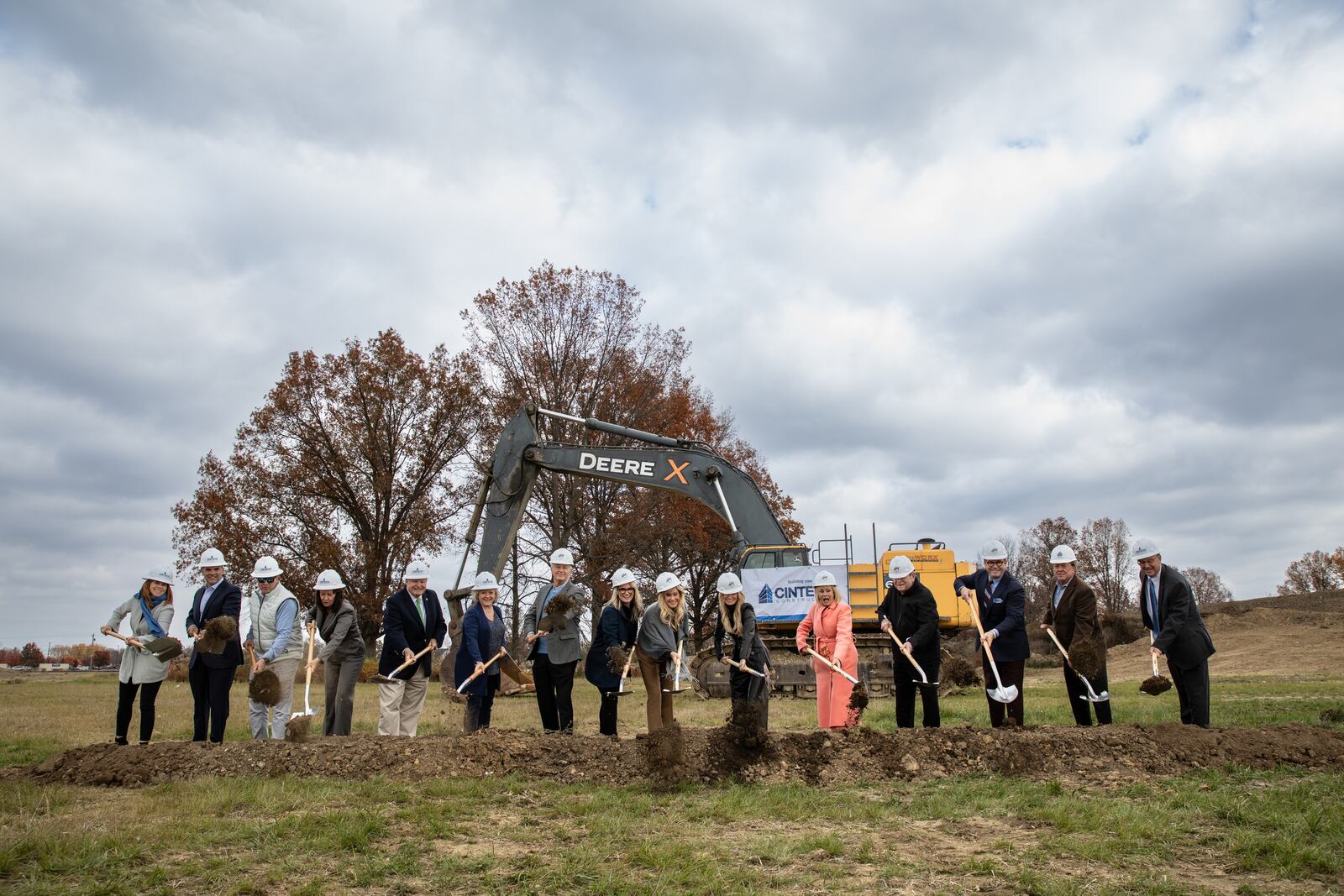 Officials from Dorothy Lane Market, the city of Mason, Traditions Building & Development Group, Western Row Developers, and Cintech Construction participated in a ground breaking ceremony on Nov. 9, 2023 for the grocer's newest store. The store will be located at Mason-Montgomery and Western Row roads in Mason. CONTRIBUTED/TRACY DOYLE, DOROTHY LANE MARKET