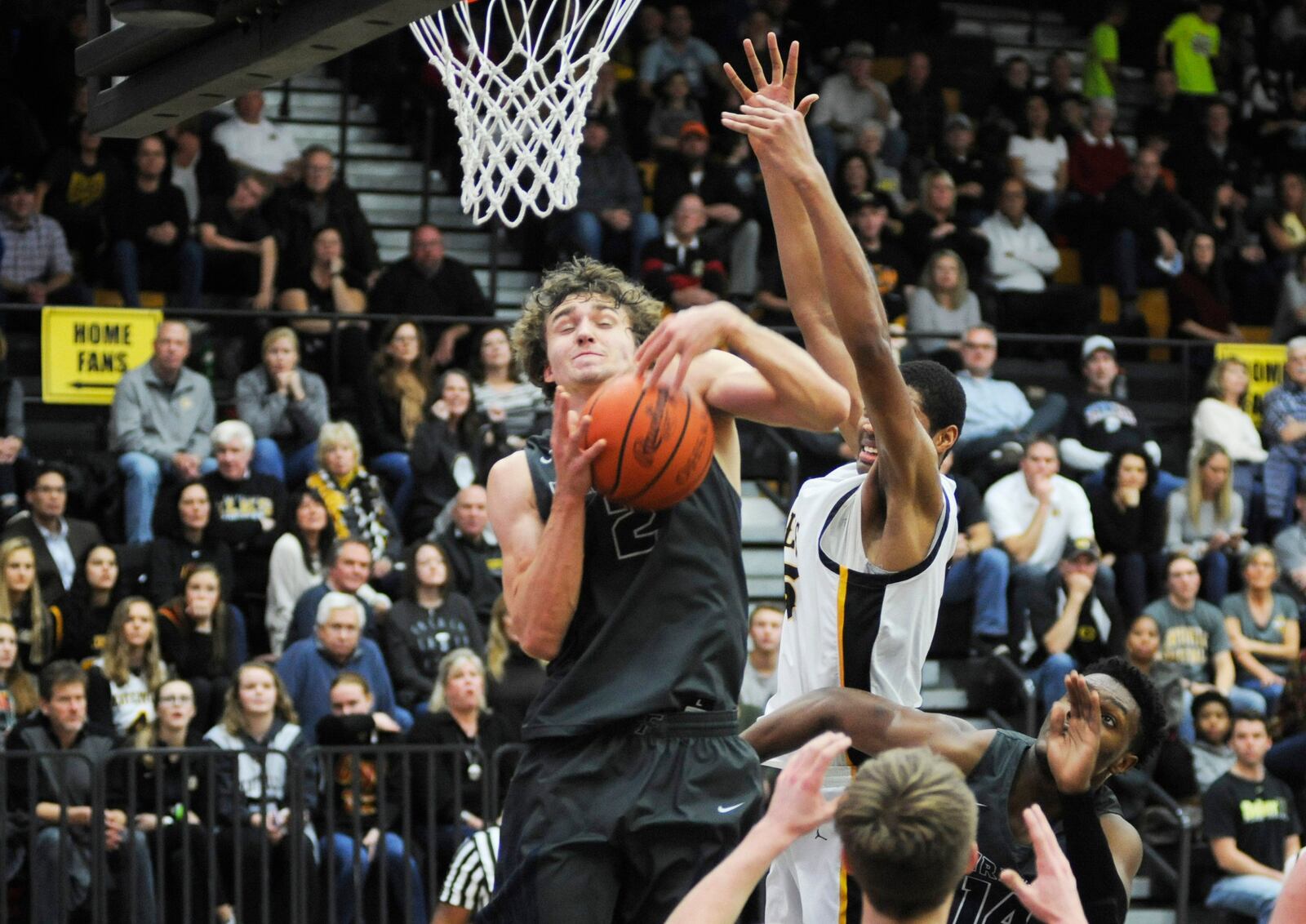 Fairmont’s Kellan Bochenek snaps a rebound away from Centerville’s Mo Njie. Centerville defeated visiting Fairmont 53-50 in a boys high school basketball game on Friday, Dec. 7, 2018. MARC PENDLETON / STAFF