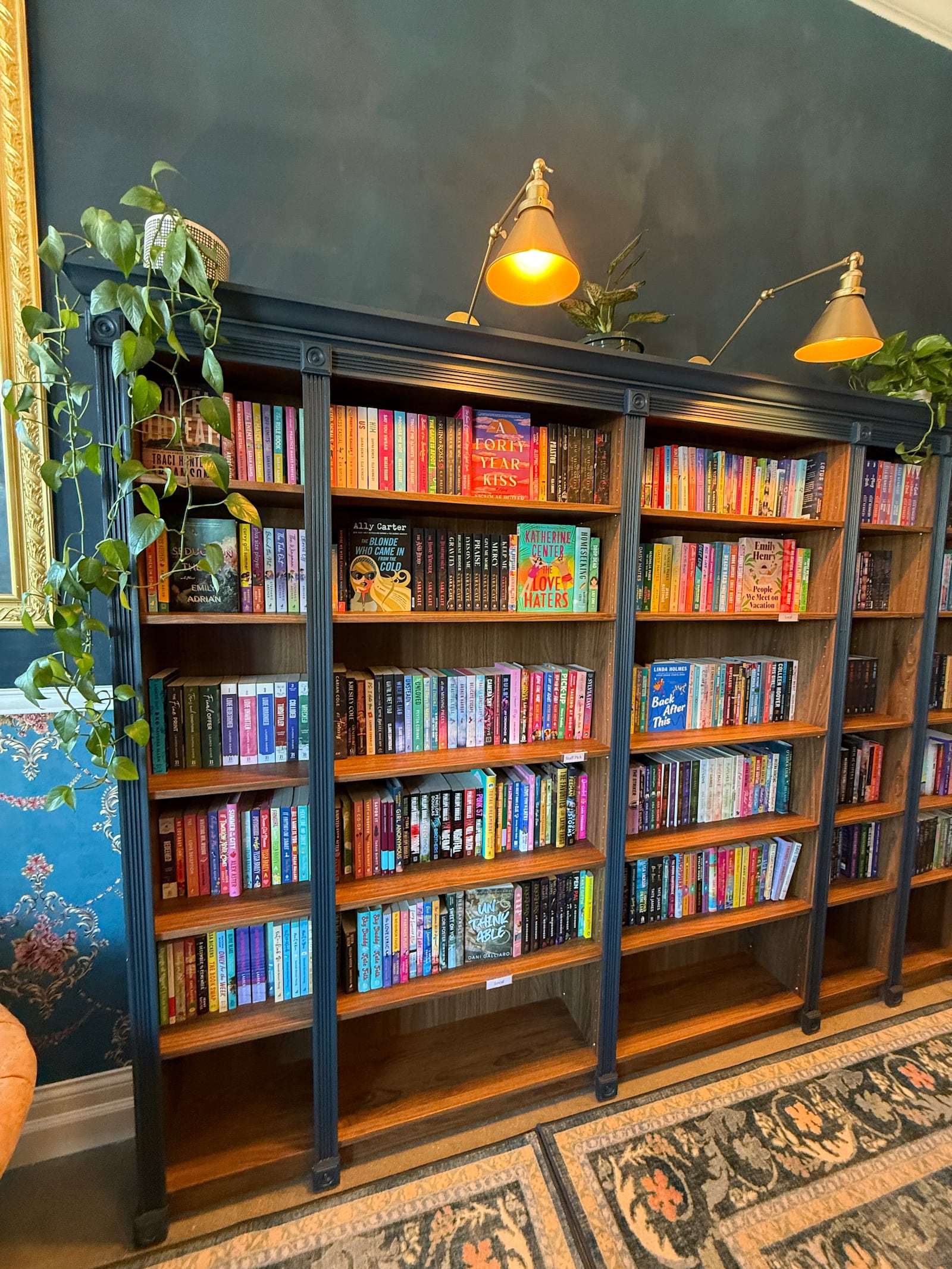 The main bookcase at Swoon Books and Wine. The new Oakwood bookstore has a cocktail menu as well as non-alcoholic drinks available and seeks to be a place of community. CONTRIBUTED