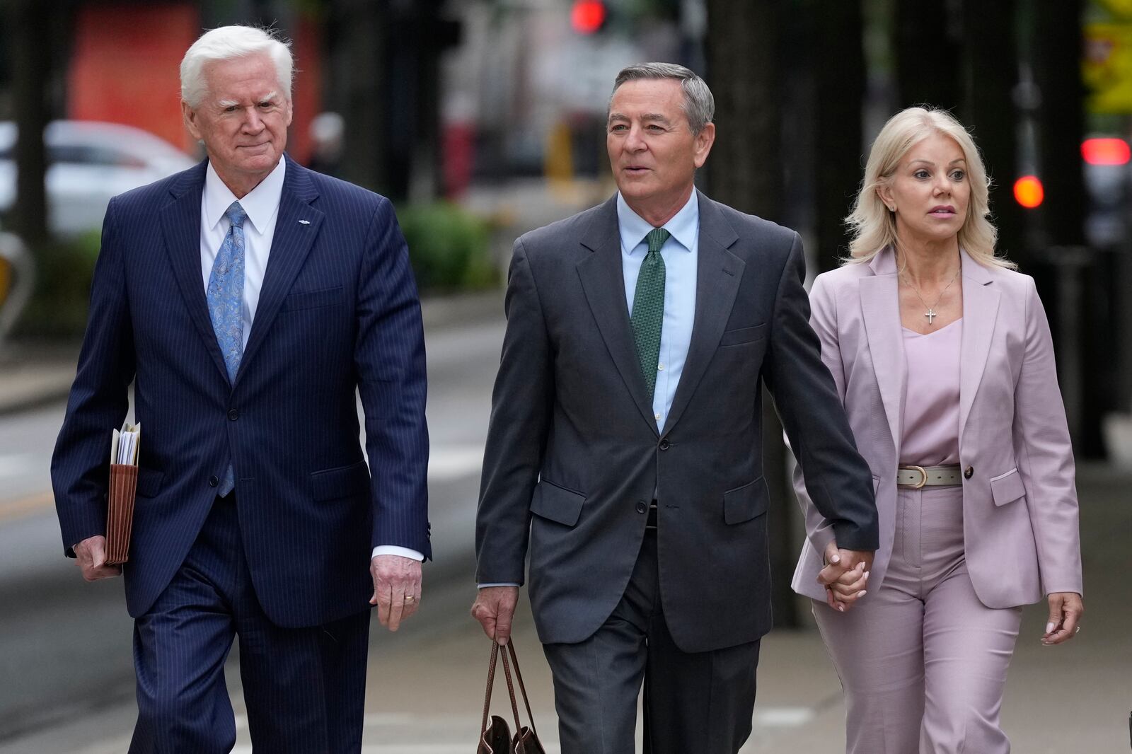 Former Tennessee House Speaker Glen Casada, center, arrives at the federal courthouse Tuesday, April 22, 2025, in Nashville, Tenn. (AP Photo/George Walker IV)