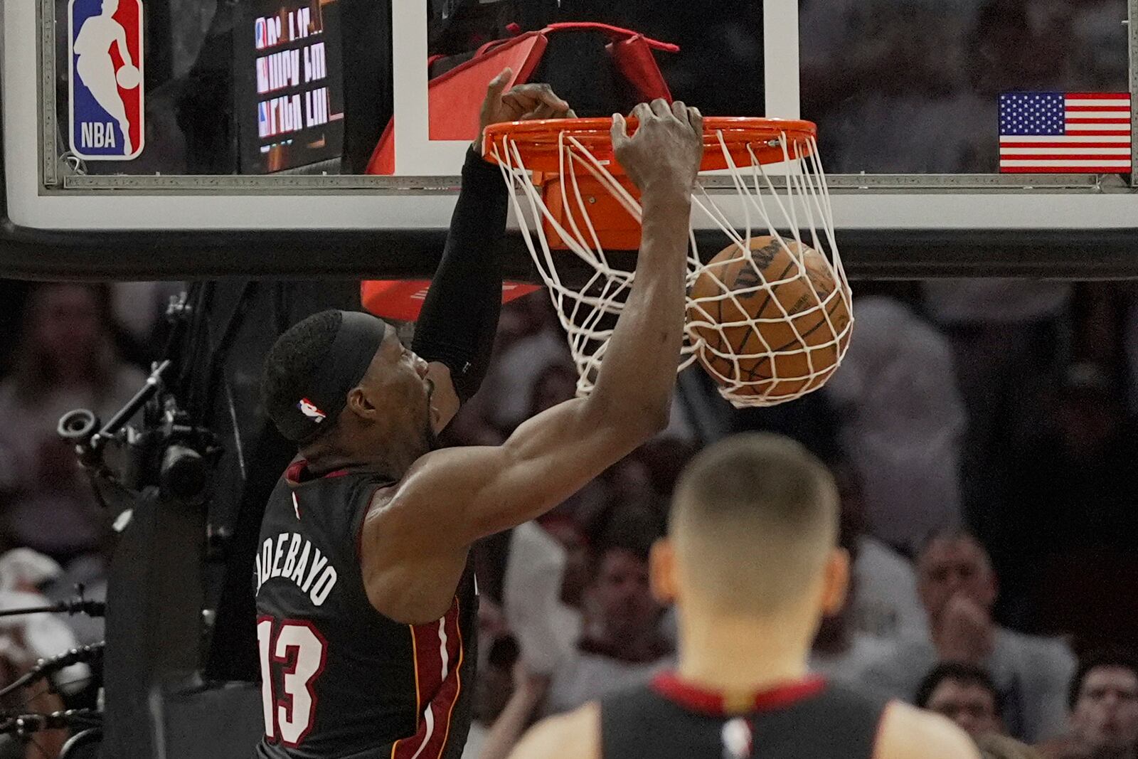 Miami Heat center Bam Adebayo (13) duels in the second half in Game 2 of an NBA first-round playoff series against the Cleveland Cavaliers, Wednesday, April 23, 2025, in Cleveland. (AP Photo/Sue Ogrocki)