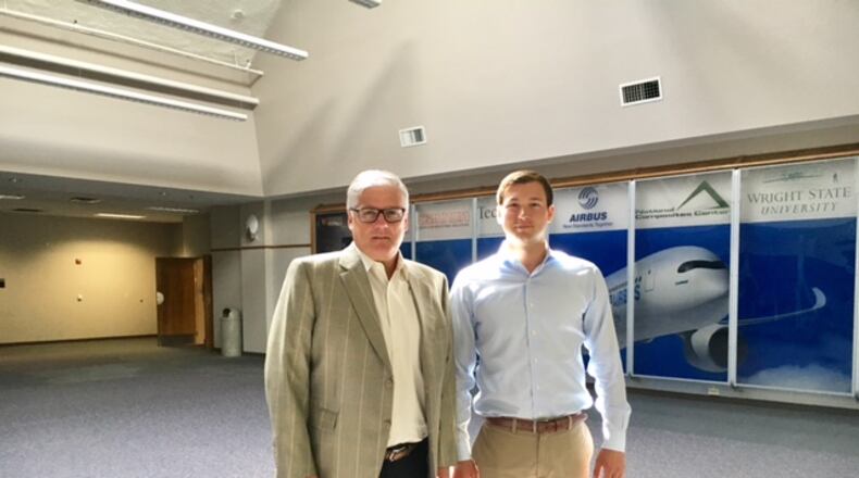 Jim McCarthy, of TW Development Group, left, with Will Goering, business and finance manager at Neyer Holdings Corp., inside the former National Composite Center. THOMAS GNAU/STAFF