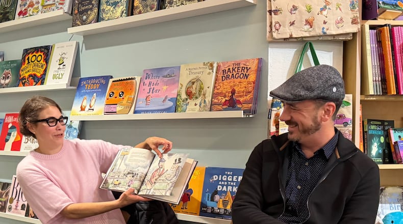 Raske (L) reading her book to an audience of children and parents on November 3 of this year at a local bookstore in Wisconsin. She loved getting feedback directly from children.