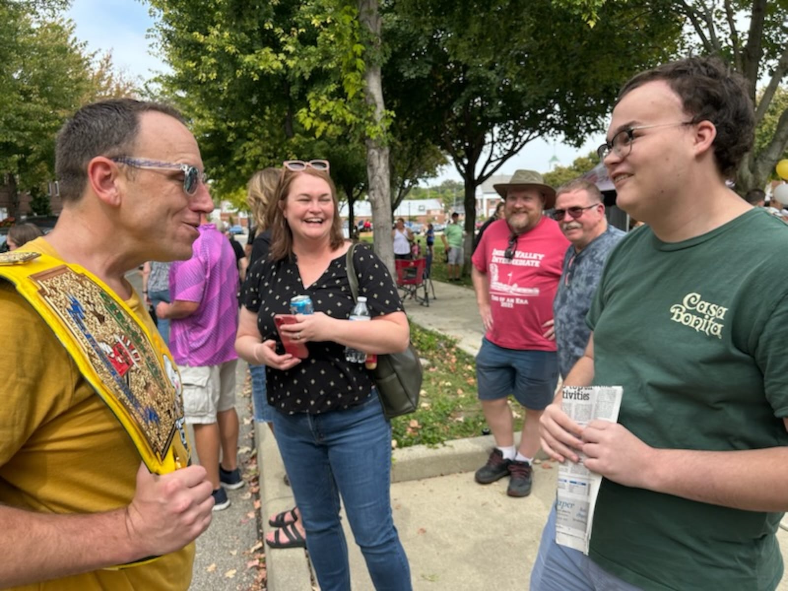 Blake Barr (right) and mom Amberly Baumgardt were among those who met MustardFEST special guest Joey Chestnut (left), known as the best competitive eater in the world on Saturday at National Road Commons Park. This was Barr's first outing following multiple surgeries that have had him in and out of the hospital since spring. BRETT TURNER FOR THE NEWS-SUN