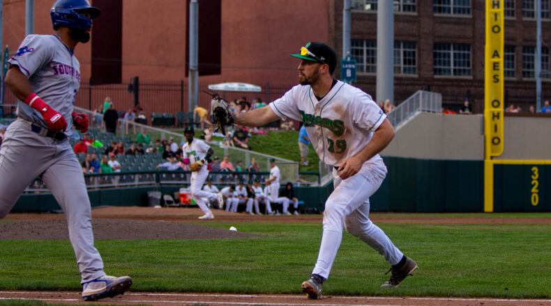 Dragons first baseman Alex McGarry tags out South Bend's Pablo Aliendo during the fifth inning of Thursday night's game at Day Air Ballpark. CONTRIBUTED/Jeff Gilbert