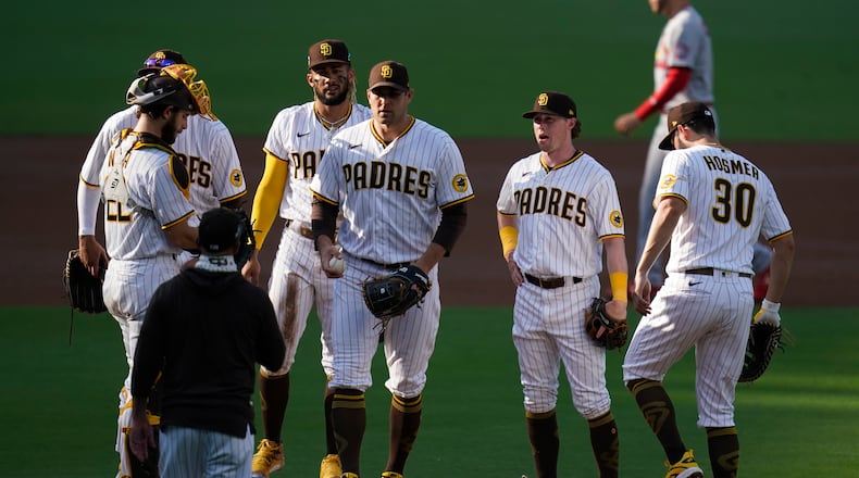San Diego Padres starting pitcher Craig Stammen leaves the game after working against a St. Louis Cardinals batter during the second inning of Game 3 of a National League wild-card baseball series Friday, Oct. 2, 2020, in San Diego. (AP Photo/Gregory Bull)