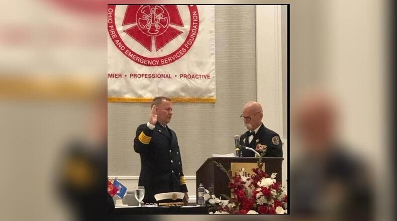 Franklin Fire Chief Jonathan Westendorf, left, was selected as the new Franklin city manager. Last year, he served as president of the Ohio Fire Chiefs Association. CONTRIBUTED
Franklin Fire Chief Jonathan Westendorf, left, takes the oath of office on July 14 as incoming president of the Ohio Fire Chiefs Association from outgoing president Mark Martin, fire chief of the Perry Twp. Fire Department in Stark County. CONTRIBUTED