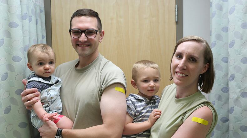 The Sidari family – Doctors Anthony and Laura Sidari and their sons Cameron and Tristan receive flu shots at the Wright-Patterson Medical Center’s immunization clinic the first week of October. (Contributed photo)