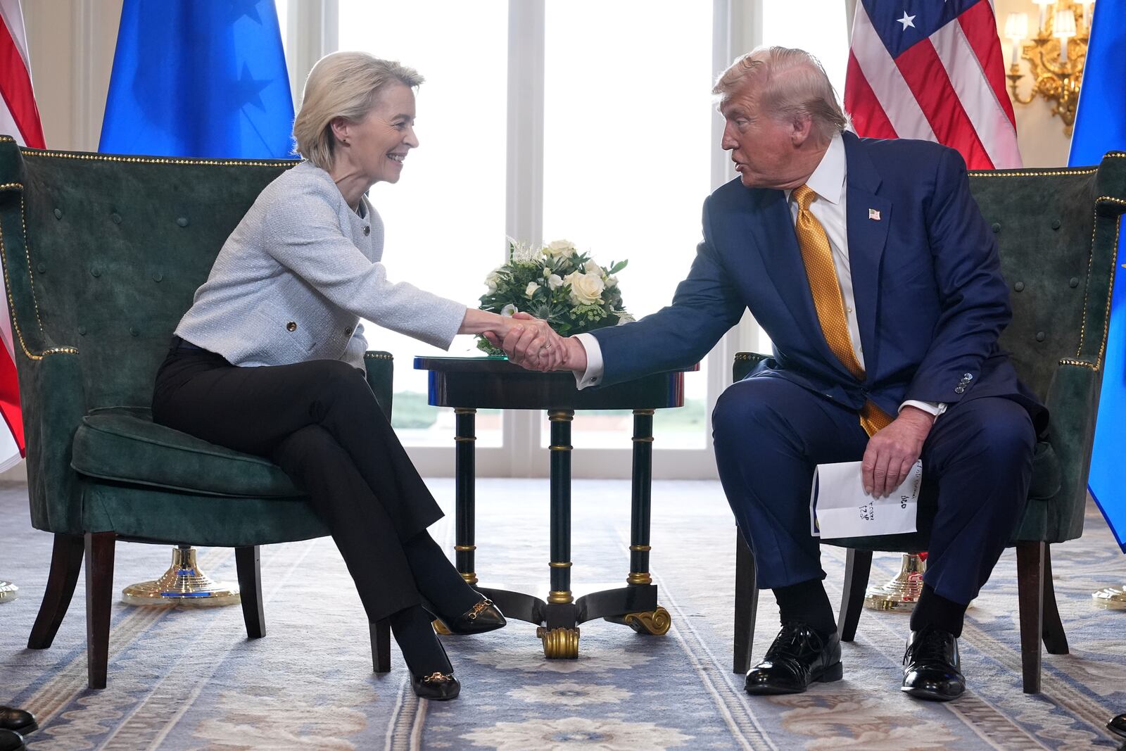 President Donald Trump and European Commission President Ursula von der Leyen shake hands after reaching a trade deal at the Trump Turnberry golf course in Turnberry, Scotland Sunday, July 27, 2025. (AP Photo/Jacquelyn Martin)