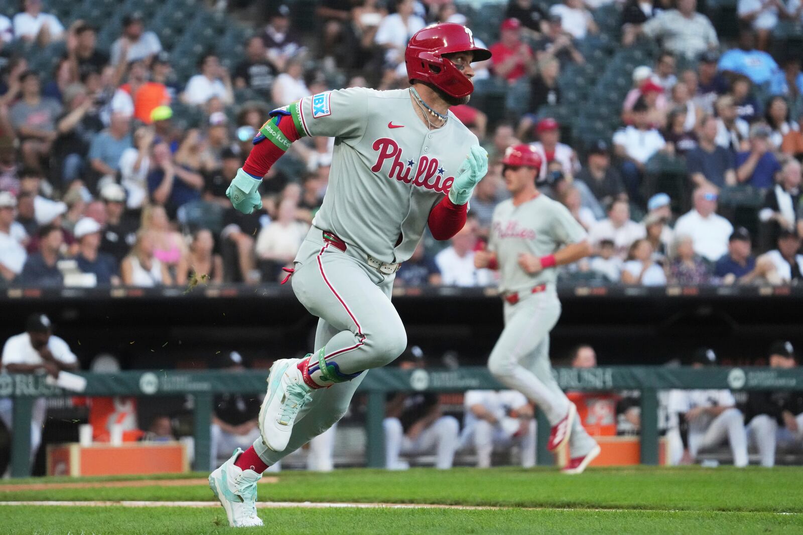 Philadelphia Phillies' Bryce Harper runs after hitting a two-run double during the third inning of a baseball game against the Chicago White Sox in Chicago, Monday, July 28, 2025. (AP Photo/Nam Y. Huh)