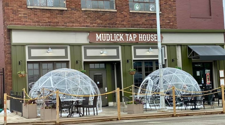 Mudlick Tap House has brought back Igloo dining to its patio in downtown Dayton.