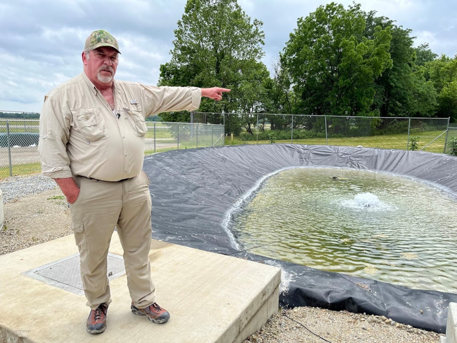 Terry Bauer, construction quality control manager for Weston Solutions working on Wright-Patterson Air Force Base, near a water basin on the base's Area A, not far from the Mad River. THOMAS GNAU/STAFF