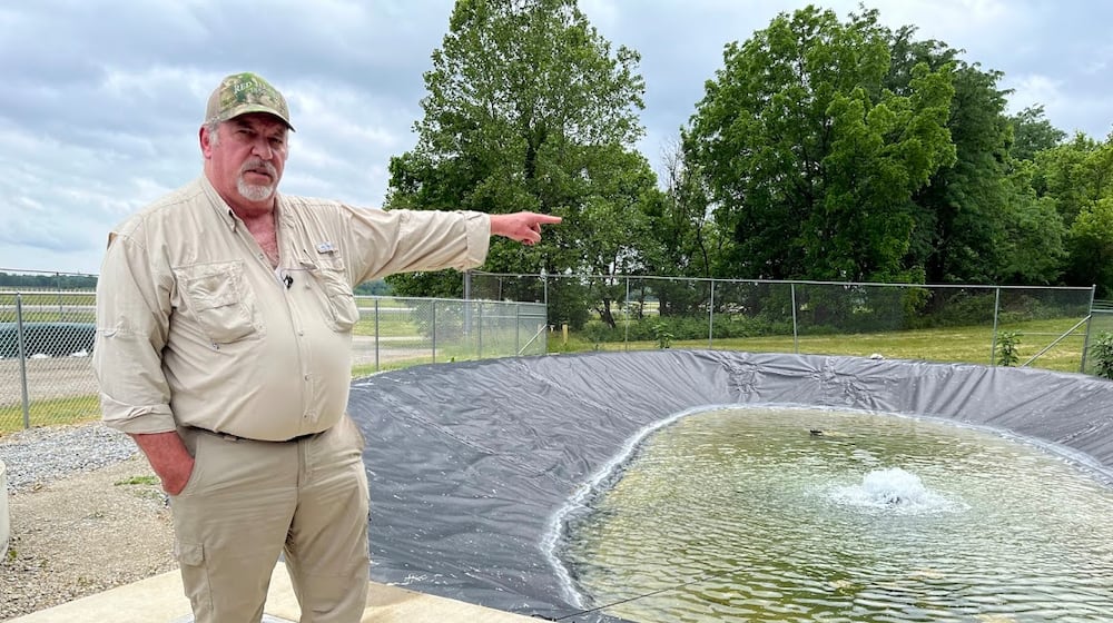 Terry Bauer, construction quality control manager for Weston Solutions working on Wright-Patterson Air Force Base, near a water basin on the base's Area A, not far from the Mad River. THOMAS GNAU/STAFF