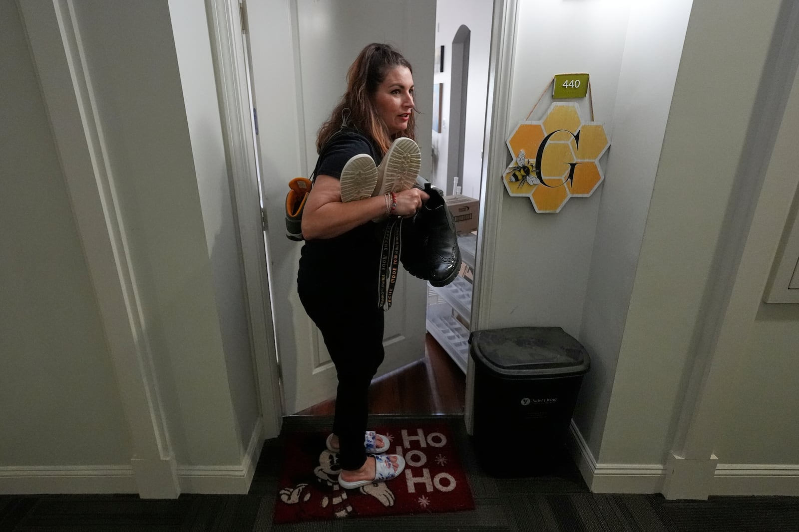 Shea Giagnorio packs belongings in her apartment days after getting fired from her job with the Administration for Children and Families, Monday, April 14, 2025, in Overland Park, Kan. (AP Photo/Charlie Riedel)