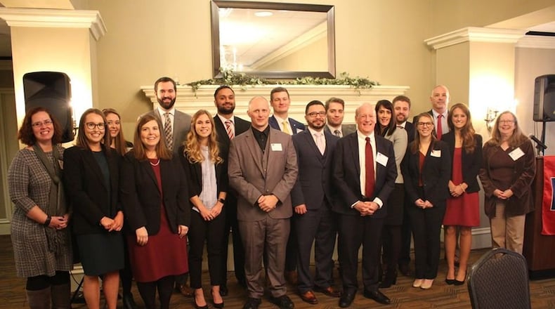 The 2019 University of Dayton School of Law class celebrates being sworn into the Ohio Bar in November with special guest, State Senator Steve Huffman who spoke at the reception. CONTRIBUTED / University of Dayton School of Law