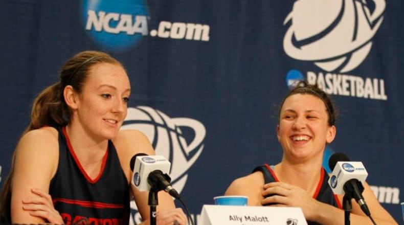 Dayton’s Ally Malott, left, and Andrea Hoover speak at a press conference in March at the Times Union Center in Albany, N.Y. David Jablonski/Staff