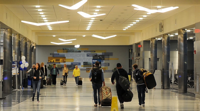 Travelers at the Dayton International Airport. The airport announced Monday, April 15, 2024 the introduction of FlyMyAirport, a digital platform integrated into the FlyDayton.com website. MARSHALL GORBY/STAFF
