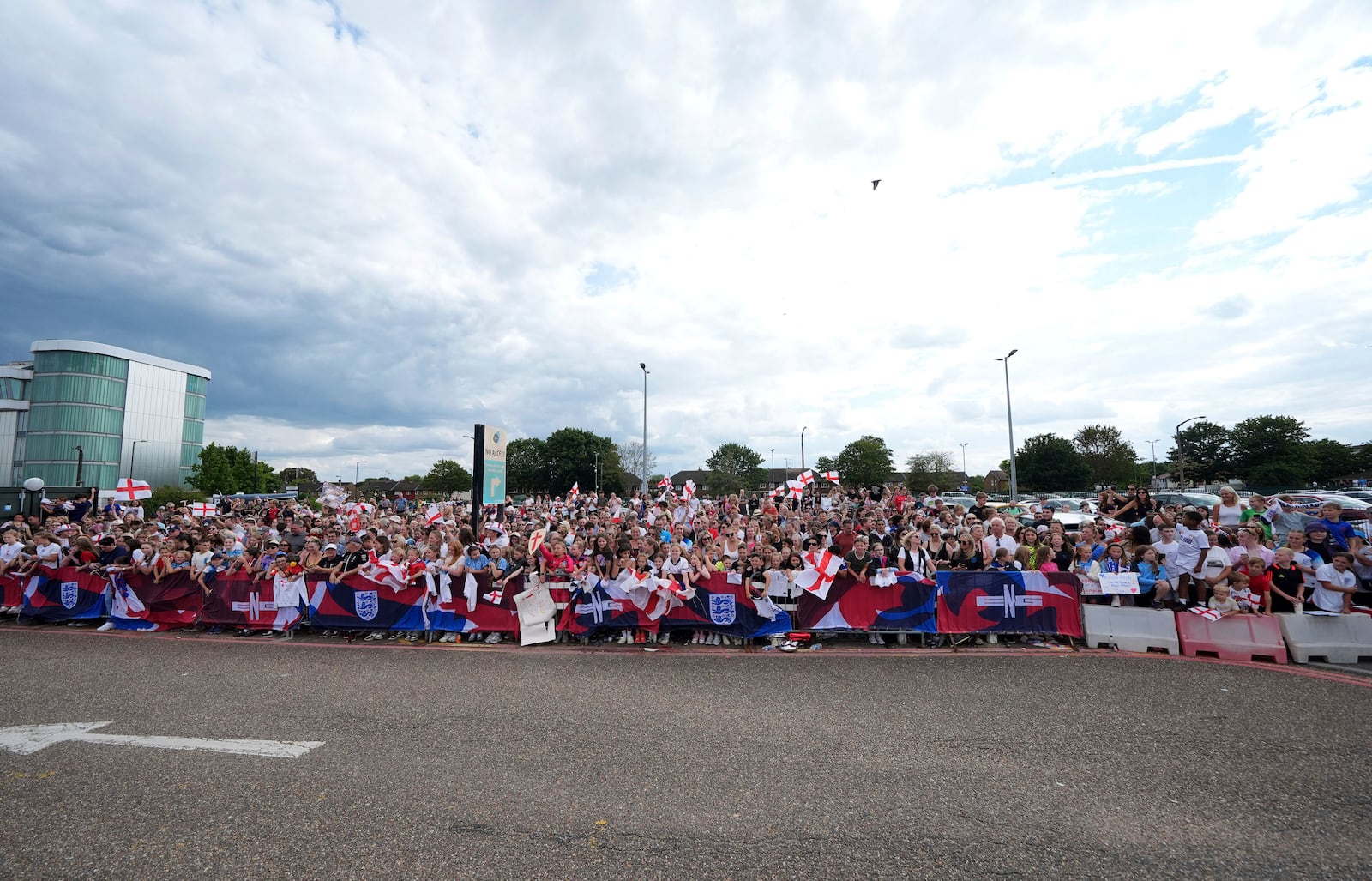 England fans waiting for the England team to arrive, outside London Southend Airport in Southend, England, Monday, July 28, 2025, after they won the Women's Euro 2025 final. (Yui Mok/PA via AP)