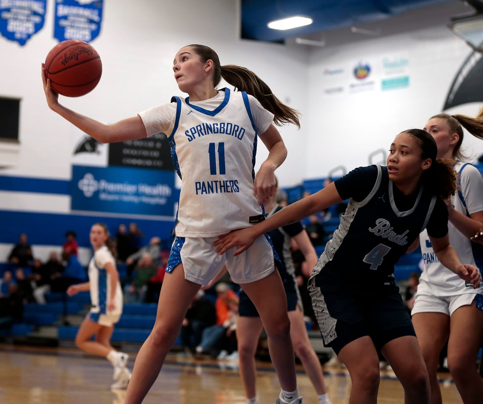 Springboro junior Baylee Cumbow (11) reaches for a rebound during a game against Fairmont on Wednesday, Dec. 10, 2025 in Springboro. STEVEN WRIGHT / STAFF