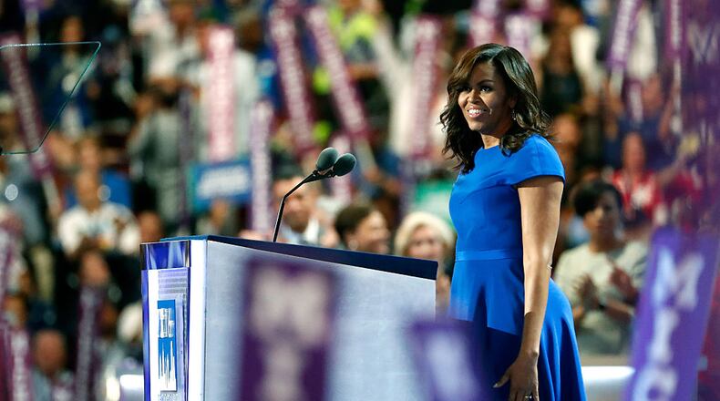 PHILADELPHIA, PA - JULY 25: First lady Michelle Obama walks on stage to deliver remarks on the first day of the Democratic National Convention at the Wells Fargo Center, July 25, 2016 in Philadelphia, Pennsylvania. An estimated 50,000 people are expected in Philadelphia, including hundreds of protesters and members of the media. The four-day Democratic National Convention kicked off July 25. (Photo by Aaron P. Bernstein/Getty Images)